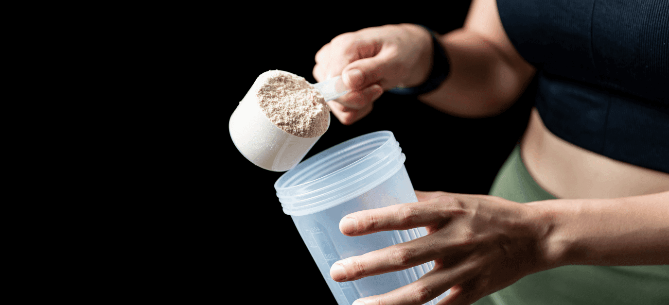 woman pours a measure of the product into a shaker