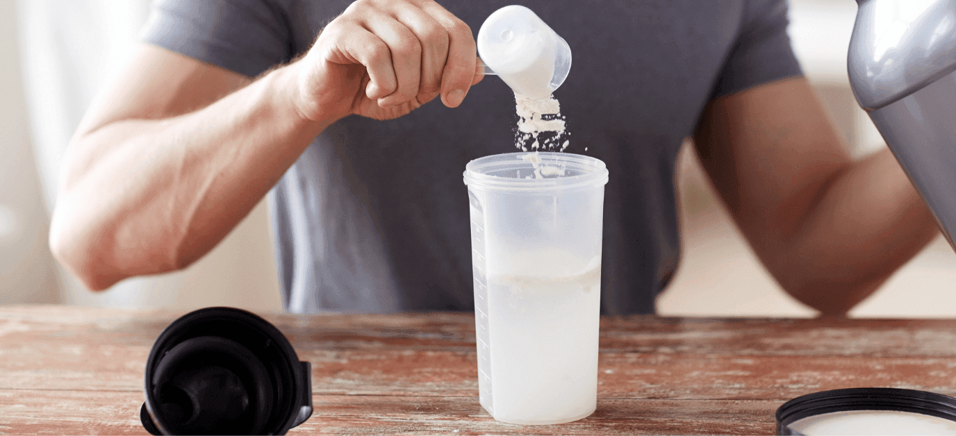 man pouring a measure of powder into a shaker