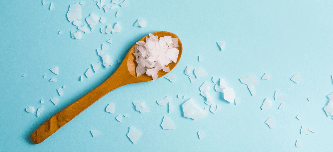 spoon with product and spilled product