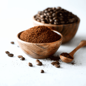 ground coffee and coffee beans in a bowl