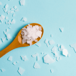 spoon with product and spilled product
